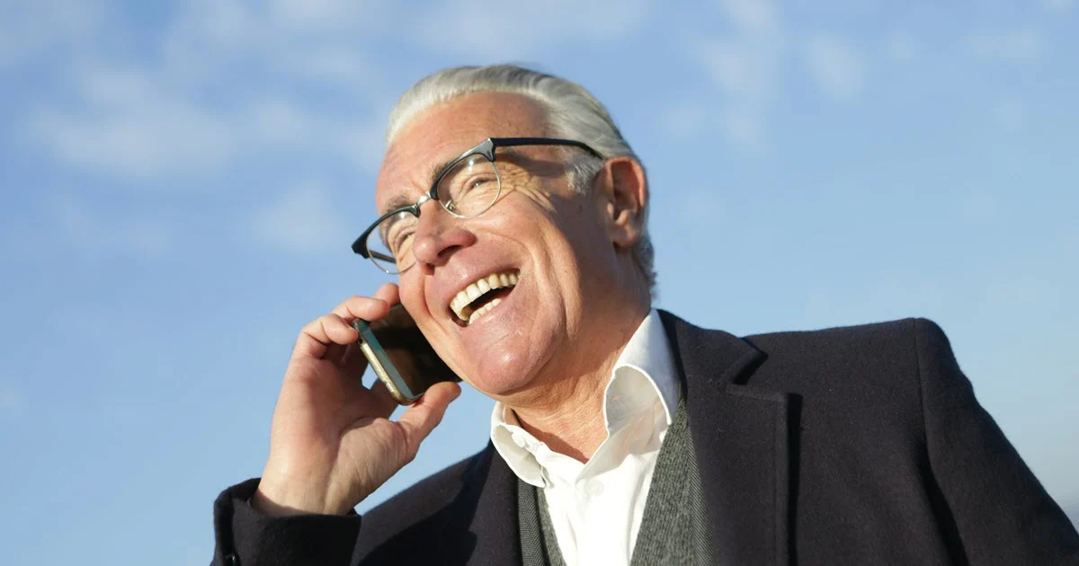 professional man on telephone smiling